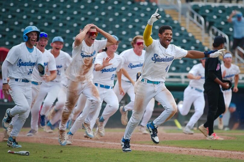 The Spartans erupt after winning the county's first state baseball championship last week at Fort Myers.