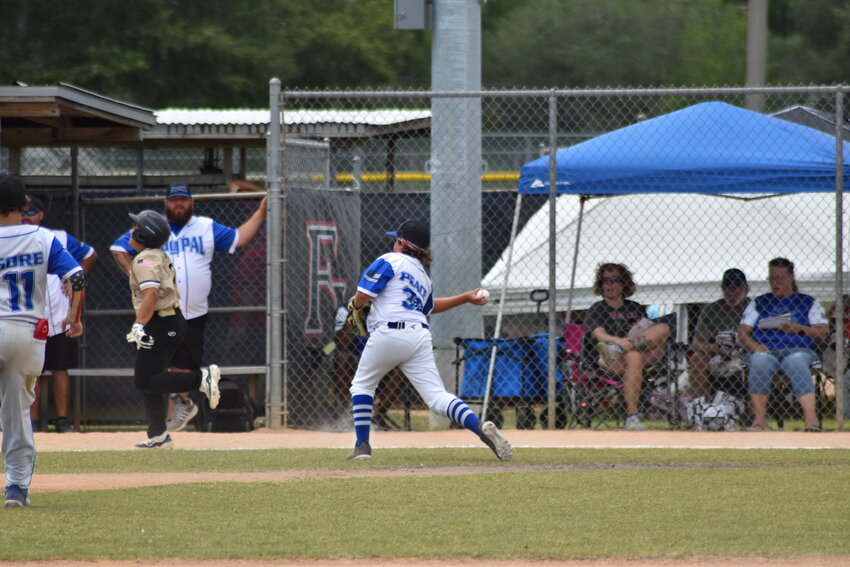 Brantley Peace of Clay PAL turns to throw out a runner from Oakleaf in their 12-under game at Paul Armstrong Park.