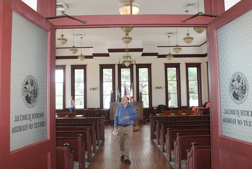 E. Wendell Hall walks through the 1890 Clay County Courthouse decades after renovating the building.