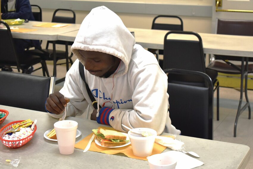 A man enjoys a meal at The Kitchen of Clay County in Orange Park. The nonprofit said it plans to open a fourth location in Keystone Heights in the fourth quarter this year.