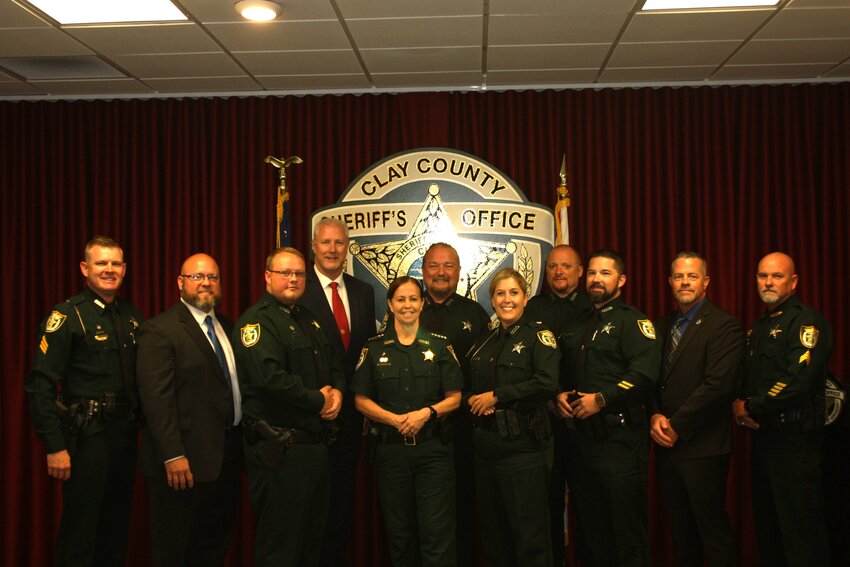 From left, Lt. Zach Cox, School Resource Sgt. Jacob Saunders, Detention Sgt. Troy Van Dyke School Resource Lt. Kenneth Wagner, Sheriff Michelle Cook, Sgt. Richard Futch, Sgt. Heather Lanier, Sgt. Daniel Cassani, Sgt. Micheal Brickey, School Resource Sgt. Mark Romano and Lt. Eddie Howell were part of a promotion ceremony Thursday at the Fleming Island substation. School Resource Sgt. Sarah Taylor was also promoted, but she wasn&rsquo;t present.