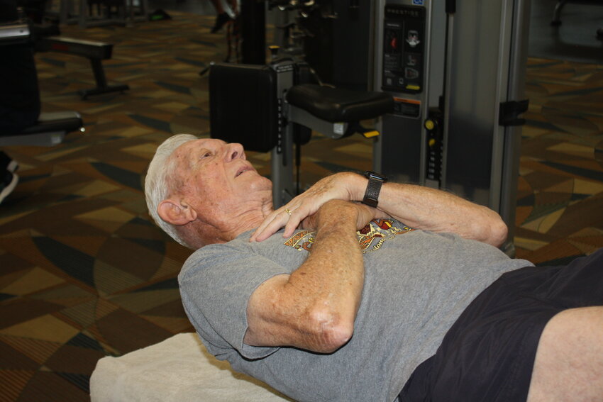 Navy Veteran Capt. David Page stretches before starting his workout.
