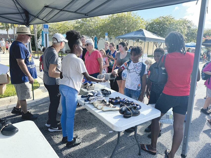 In addition to school supplies, students were able to bring clothes and shoes back home last year. The event also offered free physicals and haircuts.