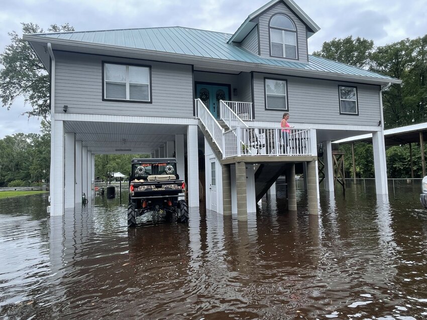 Homes built on stilts were able to sidestep the advancing Black Creek floodwaters underneath.