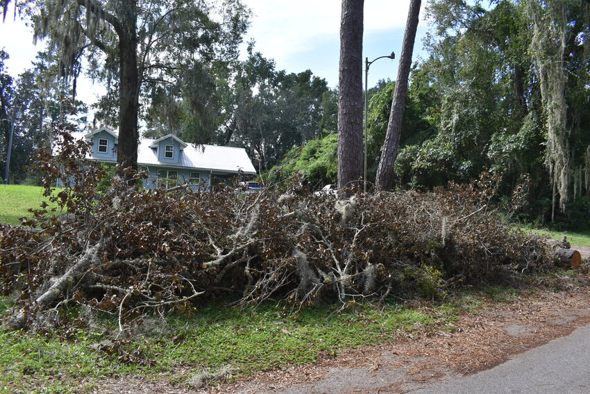 The county wants hurricane debris piled near the road before Oct. 7 so it can be picked up by a third-party vendor.