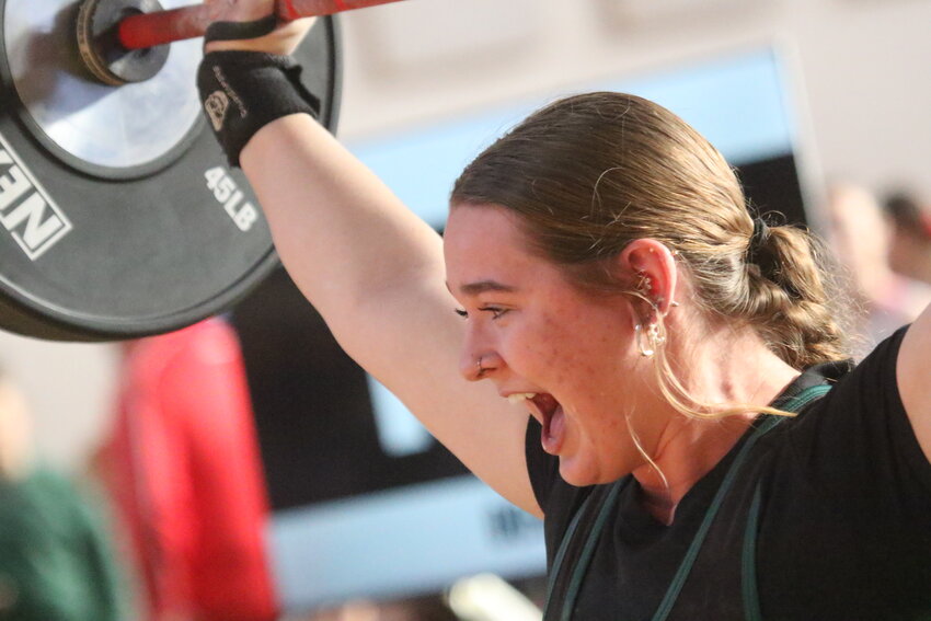 Fleming Island High weightlifter Lily O'Steen yells out after setting a personal best lift in clean and jerk en route to two district titles at her 199 weight class.