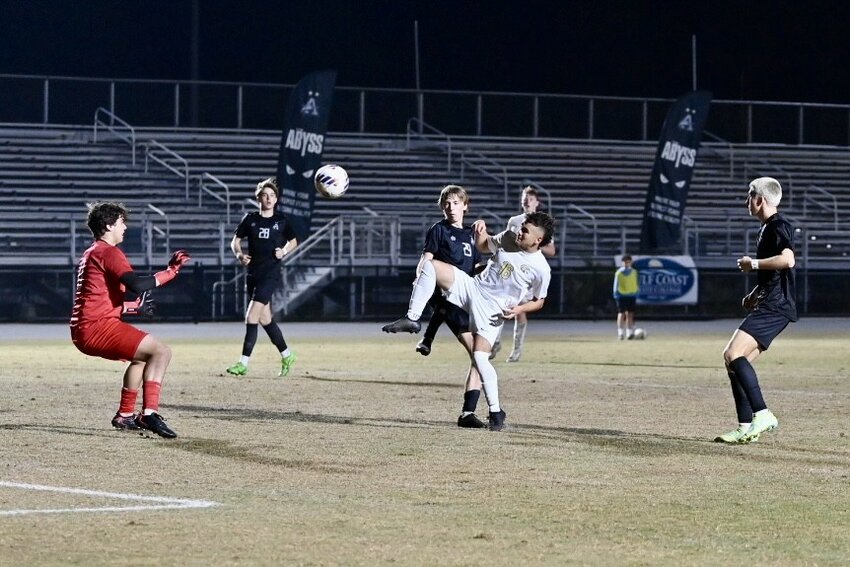 Fleming Island forward Jonathan Rodriguez punches ball in front of Arnold goal in Golden Eagles 2-1 region 1-5A semifinal loss Friday night.