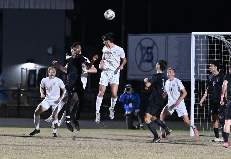 Fleming Island defender Matthew Van Hook heads ball in front of Arnold High goal in Golden Eagles 2-1 region semifinal loss on Friday.