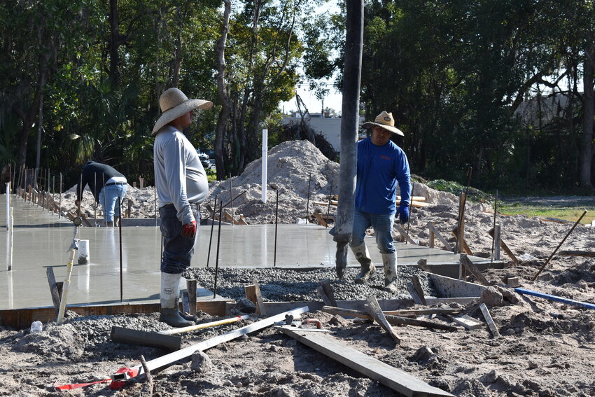 Workers poured the concrete floor Thursday, taking The Vineyard Transitional Center a step closer to becoming a reality.