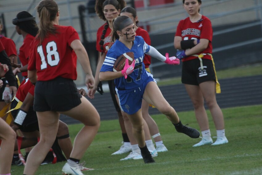 Clay High defender Kirra Dodson rolls with interception against Middleburg in Clay 18-6  win.