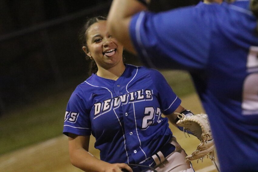 Clay High sophomore pitcher Malia Collins withstood a late innings rally by Fleming Island to walk away with a smile in the Blue Devils' 8-5 win Monday night at Clay High.