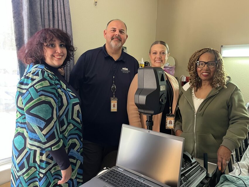 From left: Jennifer Whitman, Tim Meadows, Jackie Dalton of the Clay County Tax Collectors Office, and Deborah Thorpe after they used ID GO! to create an ID for Felisha White in her room at a local rehabilitation center.