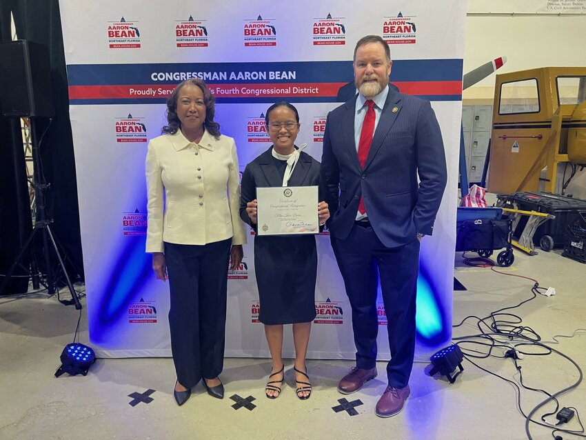Bishop John J. Snyder High's Kairi Bonzo is joined by former Florida Lt. Gov. Jennifer Carroll and U.S. Rep. Aaron Bean, after being nominated to attend the U.S. Naval Academy.