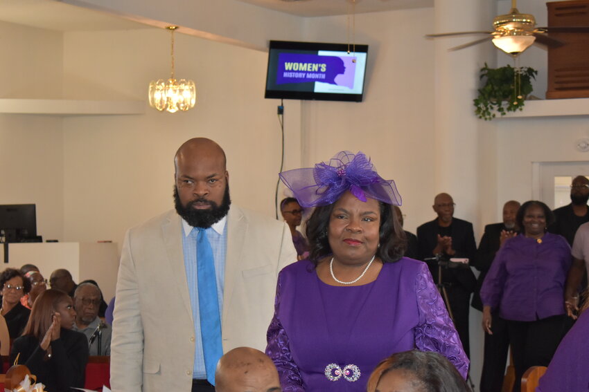 Green Cove Springs City Council member Connie Butler is escorted by her son Bruce during a Saturday ceremony honoring 32 Distinguishing Women by the Green Cove Springs Soul Food Festival.