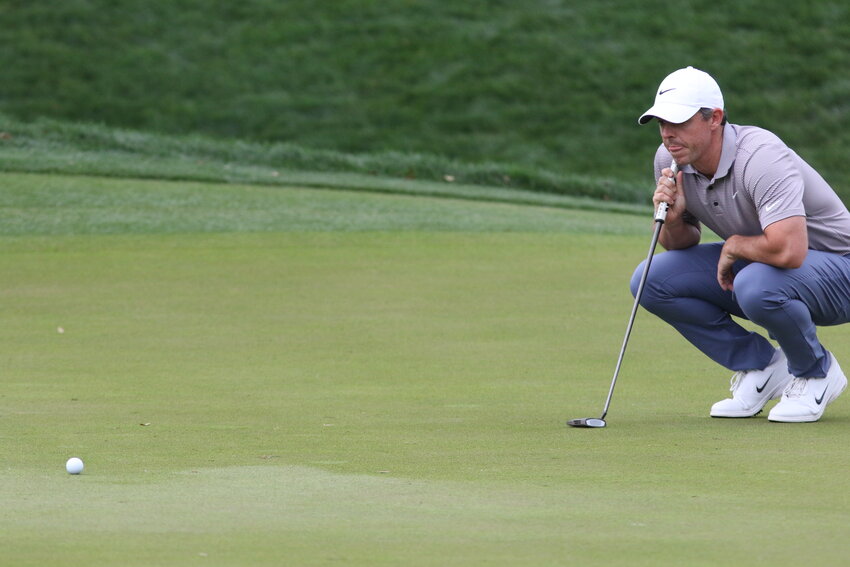 Rory McIlroy contemplates a putt on the ninth hole in Sunday's rain-delayed final round that ended with McIlroy tied at 12 under with J.J. Spaun to create a Monday morning three-hole playoff (9 a.m., 16,17, 18).