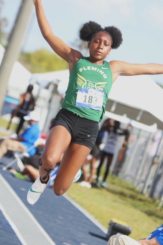 Fleming Island jump specialist Mikayla Shavers leaps to third place long jump in early rounds at Bob Hayes Invitational before dominating the triple jump with a three foot winning gap.