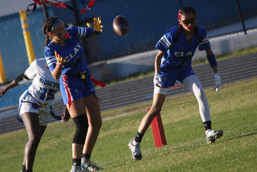 Clay High punt returners Tatum Waugh, No. 6,  and Yuliana Garcia lose control of ball on Ridgeview punt in Blue Devils' 21-0 win over Panthers.
