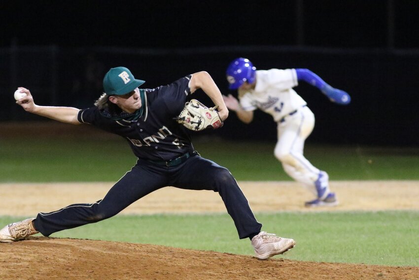 Fleming Island relief pitcher Jaxon Hatten hurls while Clay baserunner LJ Martin heads to second base in Golden Eagles' 5-1 win Friday night.