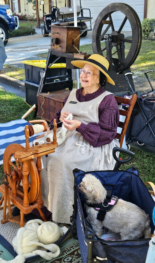 Out for a spin: Katie Dile chats about spinning wool on Saturday at the Penney Farms' Old-Fashioned Farm Day.