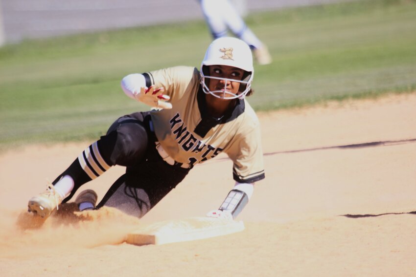 Oakleaf High baserunner Ava Tolbert, also a top hitter for the Knights, slides into second base in Knights 13-3 win over Ridgeview in the Oakleaf Tournament of Champions final game.