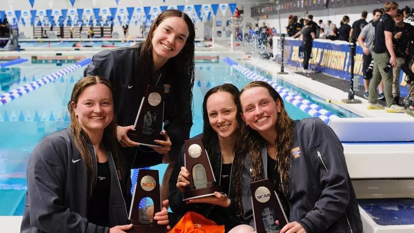Clay High grad and swim state champion Sara Stotler, far right, shows off her Tennessee Volunteers 400 medley relay trophy with teammates as Volunteers finished second to Texas for the event. Stotler and her teammates were all named All American for the finish.