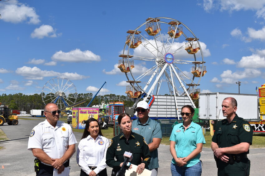 From left: County and fair officials Clay County Fire Rescue Chief David Kuykendall, Emergency Management's Kayla Sellers, Sheriff Michelle Cook, Deggeller Attractions CEO Danny Deggeller and Fair Executive Director Tasha Hyder provide a final update ahead of opening day, April 3, of the Clay County Agricultural Fair.
