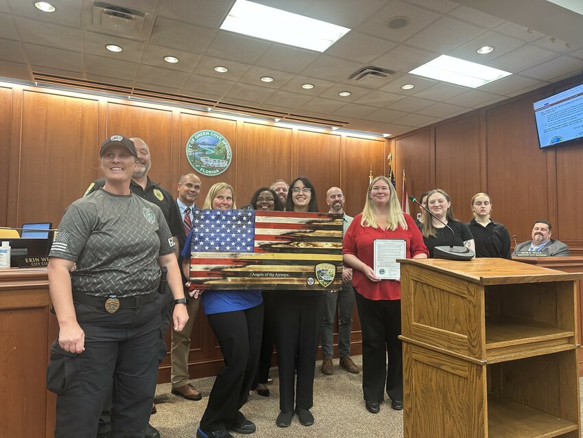 The Green Cove Springs City Council recognized its Public Safety Communications Staff during Tuesday night's meeting by presenting them with a wooden flag created by Brad Satcher and a proclamation.