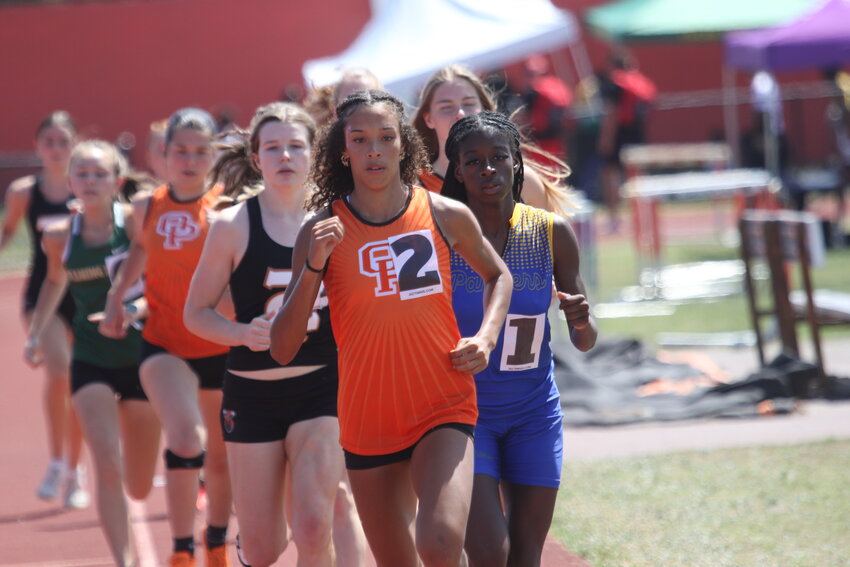 Orange Park middle distance runner Kayleana Henry leads in the Don Hall 800 meters en route to second win of the day. Henry, a state qualifier last year in the 400, won both 400 and 800 at Don Hall as she prepares for upcoming districts, regions and state meets.
