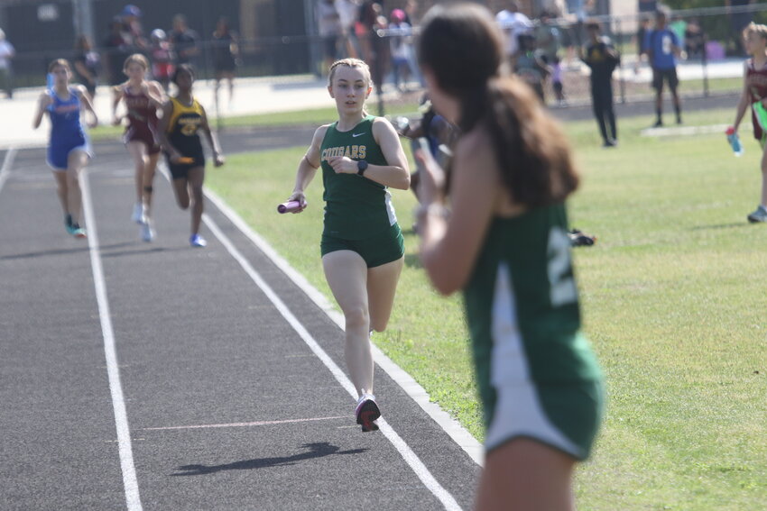 Green Cove Springs Junior High took the 4 x 800 meter relay with leadoff leg Eve Schottauer here finishing off her leg at the Northeast Florida Athletic Conference middle school track championships held at Ridgeview  High School.