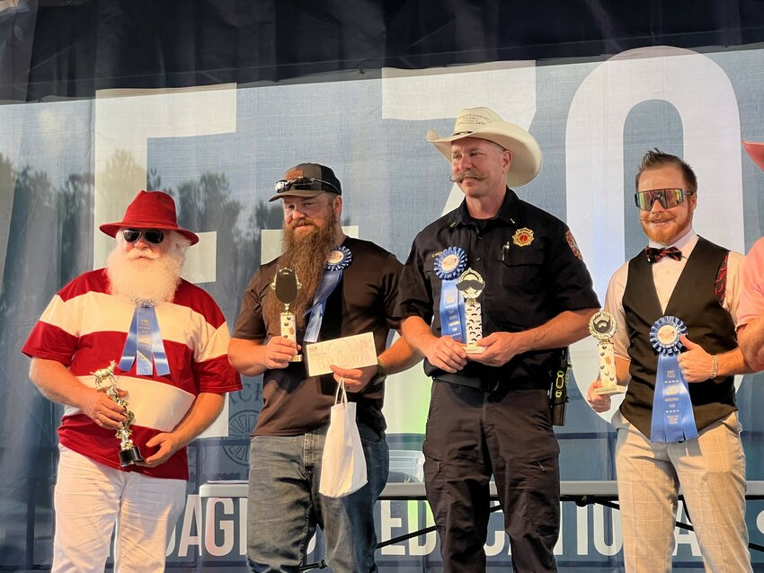 From left: Ronald John's for "Best Freestyle," Dwayne for "Longest Beard," Lt. Chris Hammock for "Best Mustache," and Parker Subirats for "Best Groomed Whisker Face."