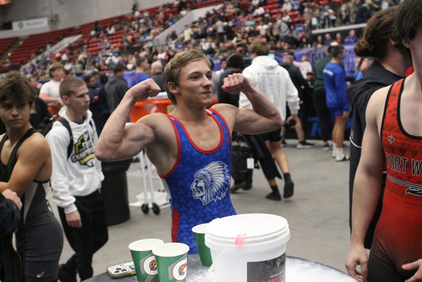 Keystone Heights 119 weightlifter Elijah Mize flexes after learning his bench press finish was enough to win the Class 1A Traditional title in Saturday's state championships in Lakeland. Keystone Heights finished third in both Olympics and Traditional.