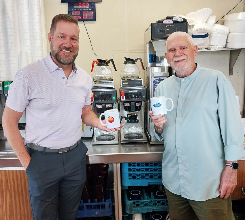 Martin Coffee President Ben Johnson, left, and Sunrise to Sunset Principal Manager Richard Clark