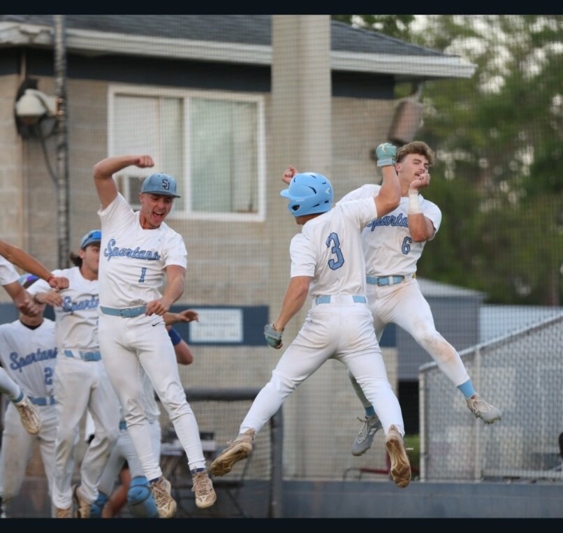 St. Johns Countrry Day School batter Nick Bowden, No. 3, celebrates his home run with teammates during Spartans 8-7 thriller win in region 1-1A semifinal series win over North Florida Christian. St. Johns, the No. 1 seed, will  host the region final series starting May 5. St. Johns will play the winner of the University Christian vs. St. Joseph Academy semifinal series that is heading to a game three.
