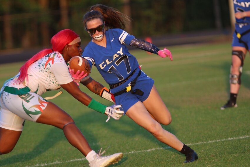 Clay High wide receiver and defensive back Kirra Dodson, noe of fastest runners on Blue Devils lineup, had two breakaway runs to set up Clay offense in 20-6 win over Orlando Jones in region playoff opener.