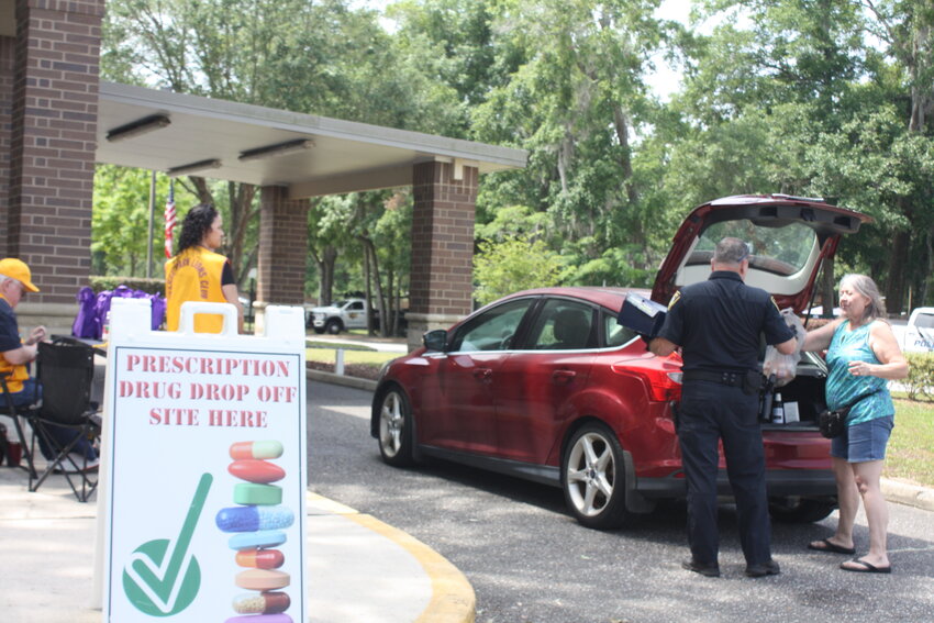 An officer with the Orange Park Police Department collected pills during the drive-up event.