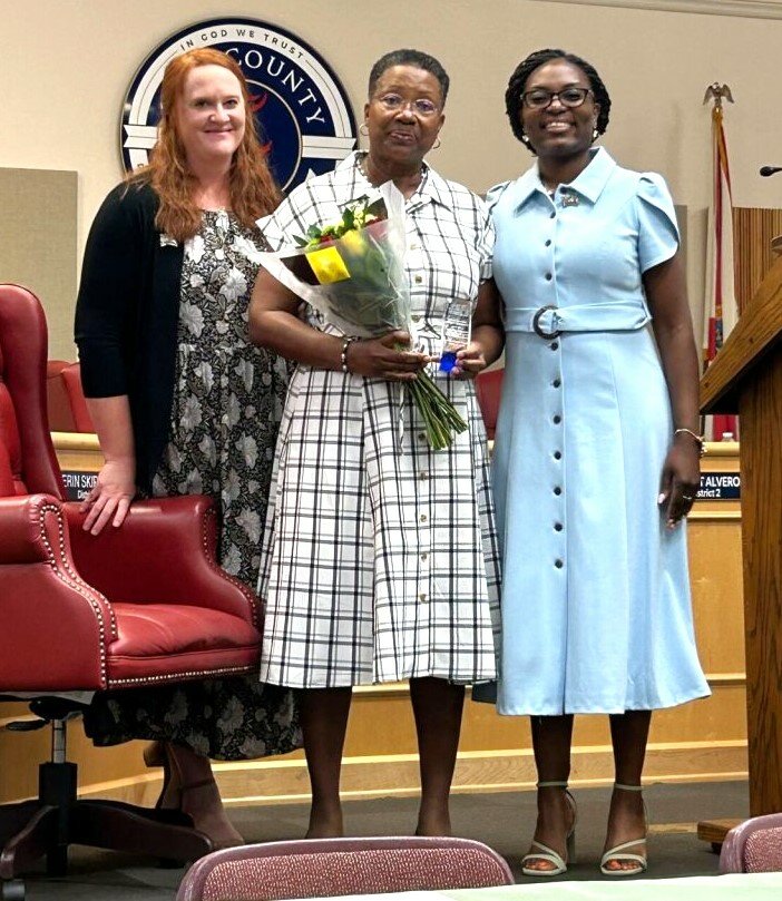 Janice Tucker is honored for over 20 years of dedication to Take Stock in Children during a May 3 ceremony at Fleming Island High School.