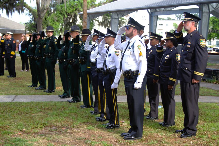 Law enforcement and fire rescue responders stood at attention during the Police Memorial Ceremony.