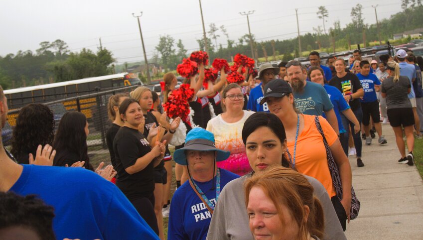 Clay County High Special Olympic athletes received hero's welcomes on Friday at Middleburg High during their "Fun Day."