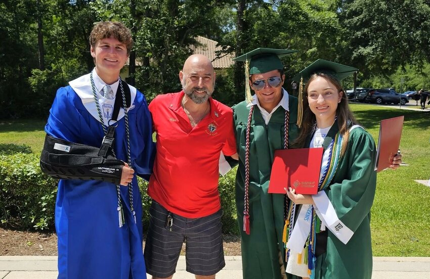 From left: Braden Glavin, Grand Knight Mike Cruz, Antony &quot;AJ&quot; Olivolo and Emma Schlotthauer. (Ryan Lydon not pictured)