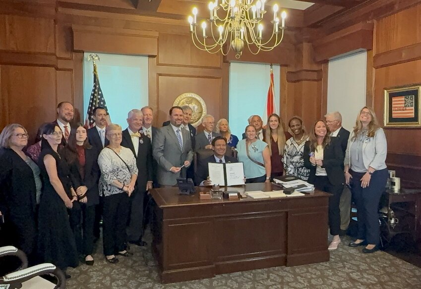 Gov. Ron DeSantis signs the Jane Rock Act.