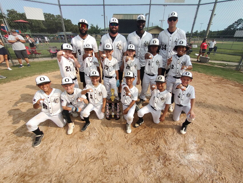 The Oakleaf Knights 8Unders All Stars show off their District 3 championship bling; rings and trophies, after dramatic 8-7 walk off win for title in Saturday championship tournament. Oakleaf advances to state tournament with 15-2 season record.