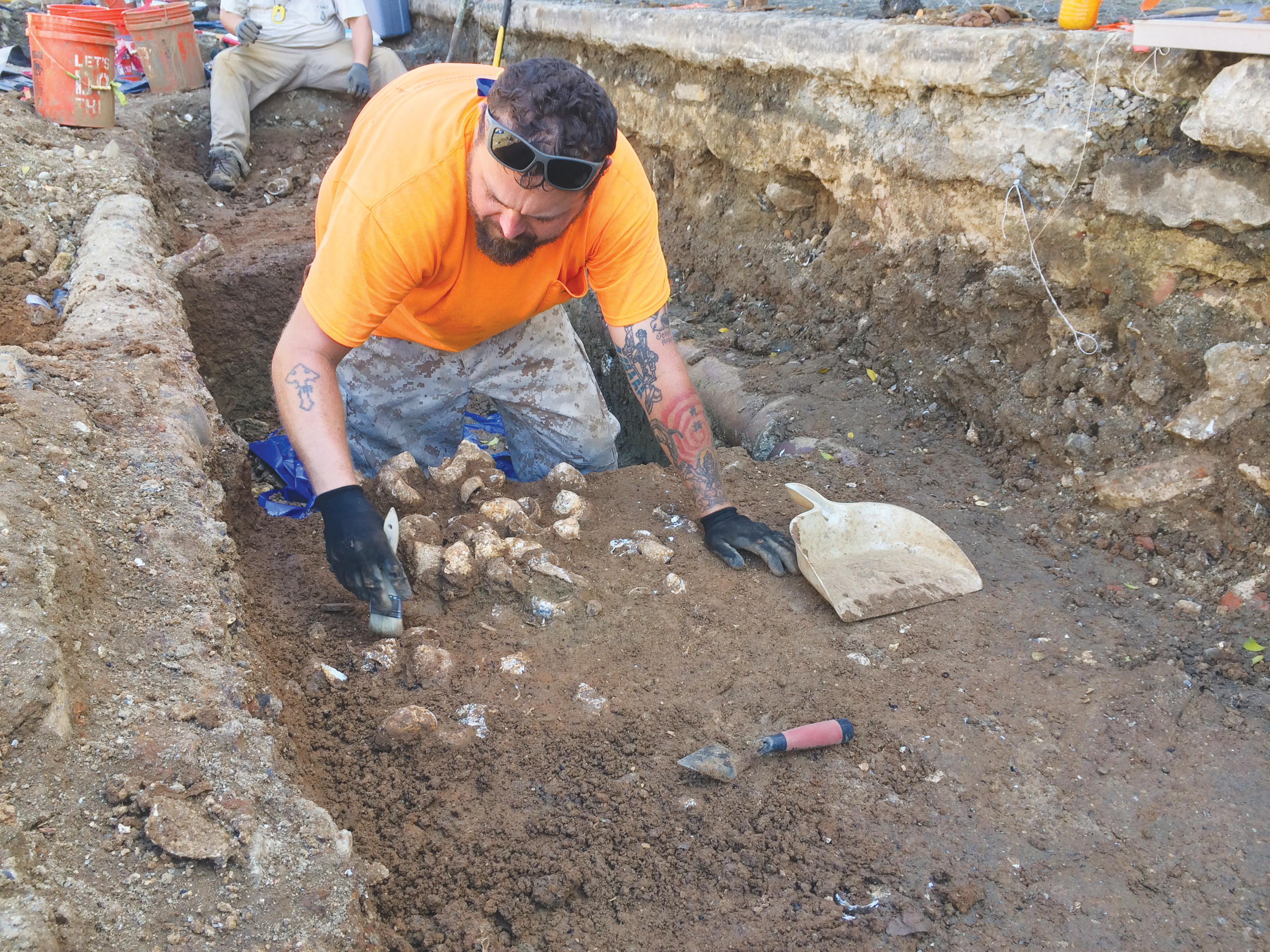 Blue Nelson, a Middleburg High graduate and co-host of The History Channel show “Found,” is shown here excavating a midden in downtown Charlotte Amelie in St. Thomas, Virgin Islands.