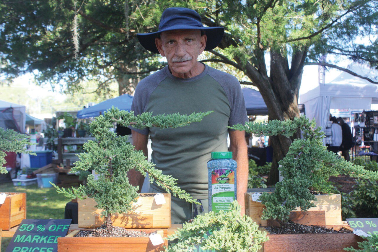 Bonsai Dale, owner of Evergreen Exotics, was on hand at the Town's Fall Festival to pitch residents on purchasing his unique houseplants.