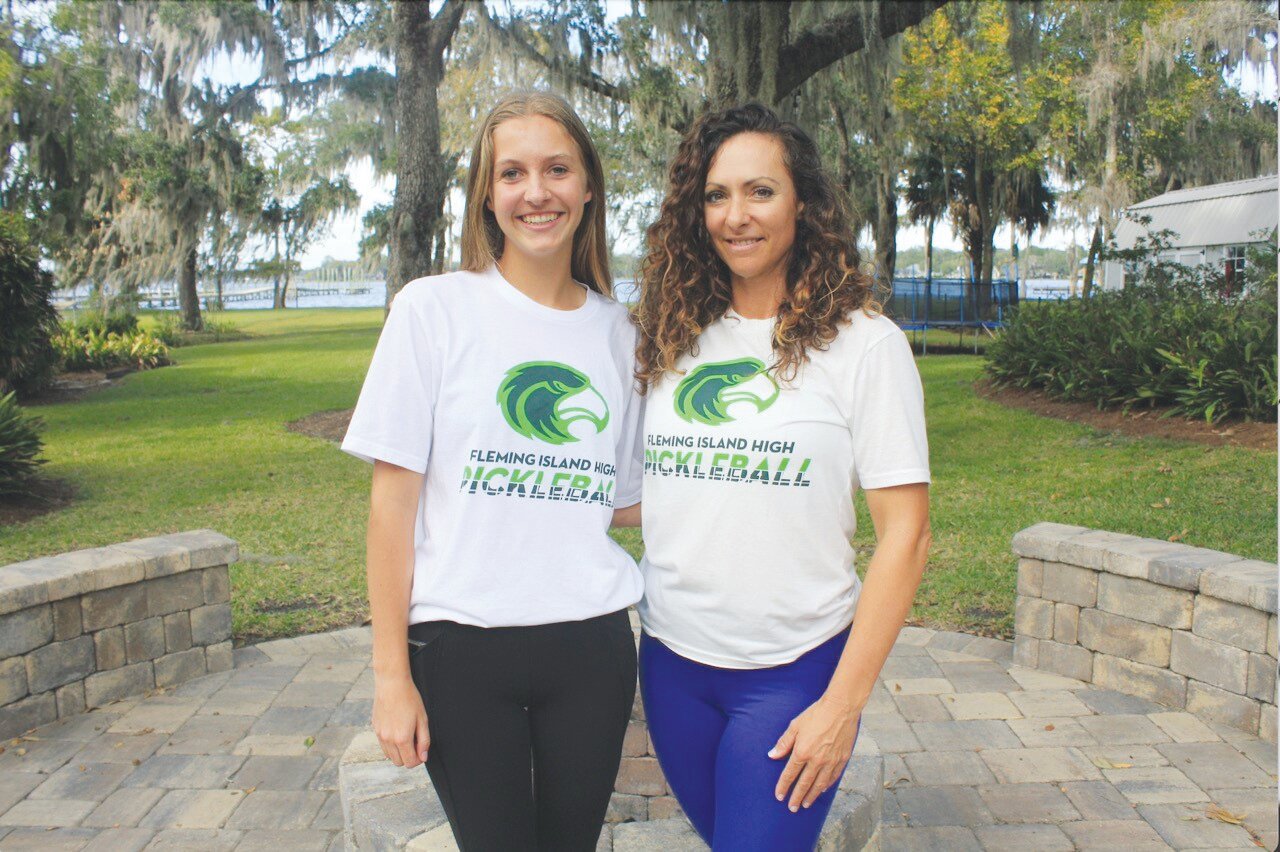 Tessa Wilson, a star local pickleball and tennis player who was instrumental in kickstarting the club pickleball program at Fleming Island High this August, stands alongside Victoria El-Zarif, a parent whose son, Ahmad, stars at mixed doubles with Wilson in travel tournaments played across the state.