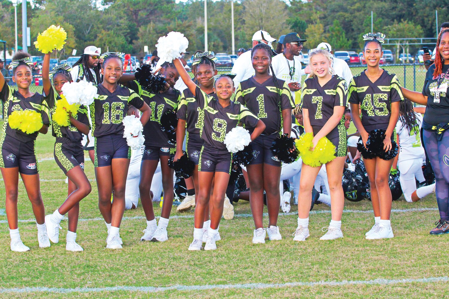 Oakleaf Renegades cheerleaders get their smiles on in the post-game huddle with the team after 21-0 playoff win over Grand Park propelled the team to the Division championship next week at Lake Mary High with a shot at Pop Warner National Championship two weeks later.