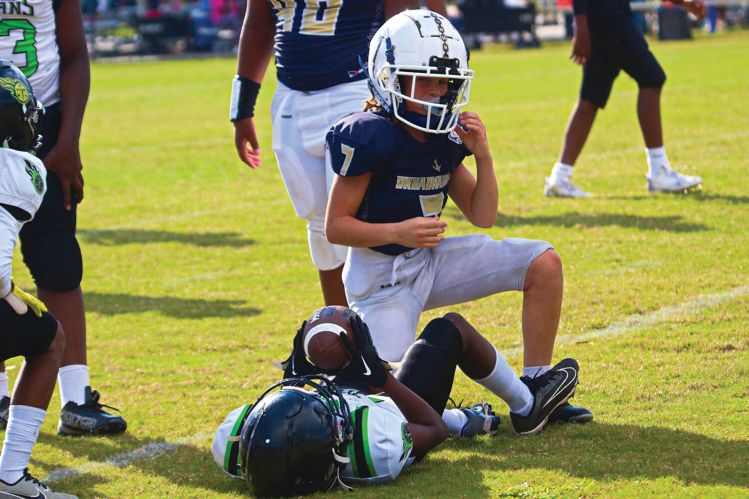 Fleming Island Dreadnaughts 11-under defender Brandon Mcintosh blasted through for this second-half sack in Dreadnaughts dominating 38-6 win over Titletown Titans, the defending Pop Warner national champs.