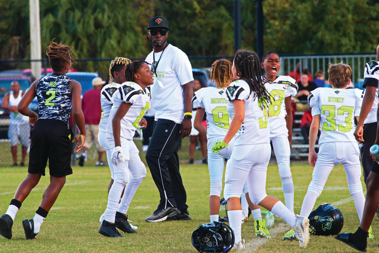 Oakleaf Renegades coach Rikiese King gets a look at his team celebration after a 21-0 win over Grand Park, led by Kerrie Wilson's chants.