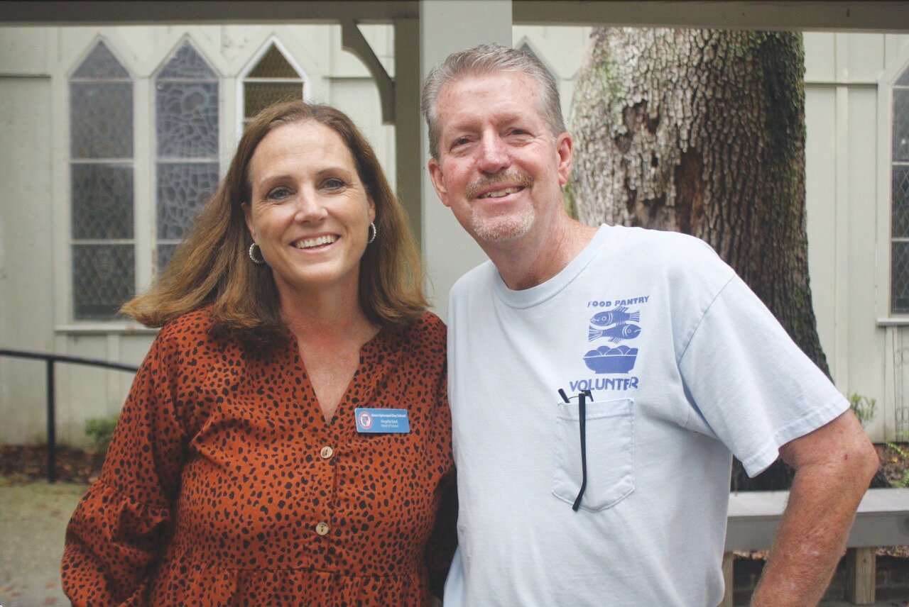 Grace Episcopal Head of School Angela Bast, left, and Jim Brewer, a volunteer with the Food Pantry, were proud of the 1,872 pounds of the school collected to help feed the hungry.