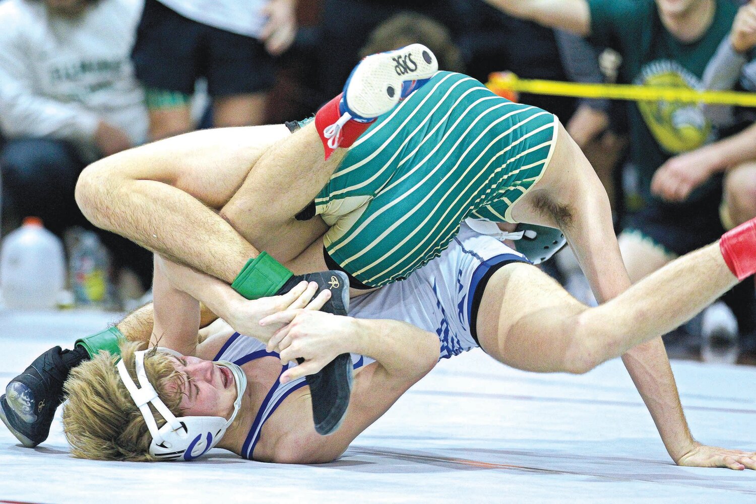 Clay High’s Jacob Bucci, in white, battles upside down with Fleming Island’s Matthew Newman in 2023 action. Both Bucci and Newman will be key athletes for their respective teams as area grapplers ramp up their seasons.