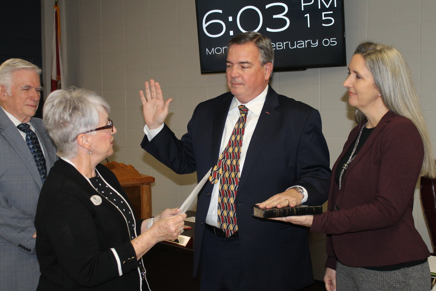 City Manager Charlie Van Zant Jr. is sworn in with his family present. One of his first duties is to finalize the purchase and acquisition of a plot of land on the intersection of SR 100 and SR 21.